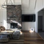 open living room with stone fireplace