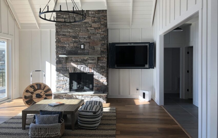 open living room with stone fireplace