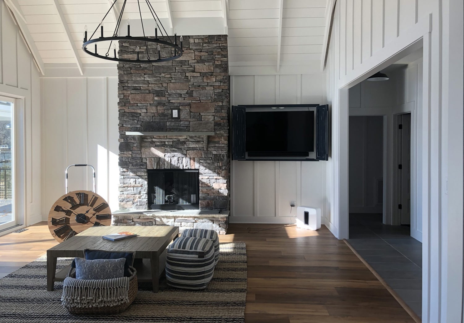 open living room with stone fireplace